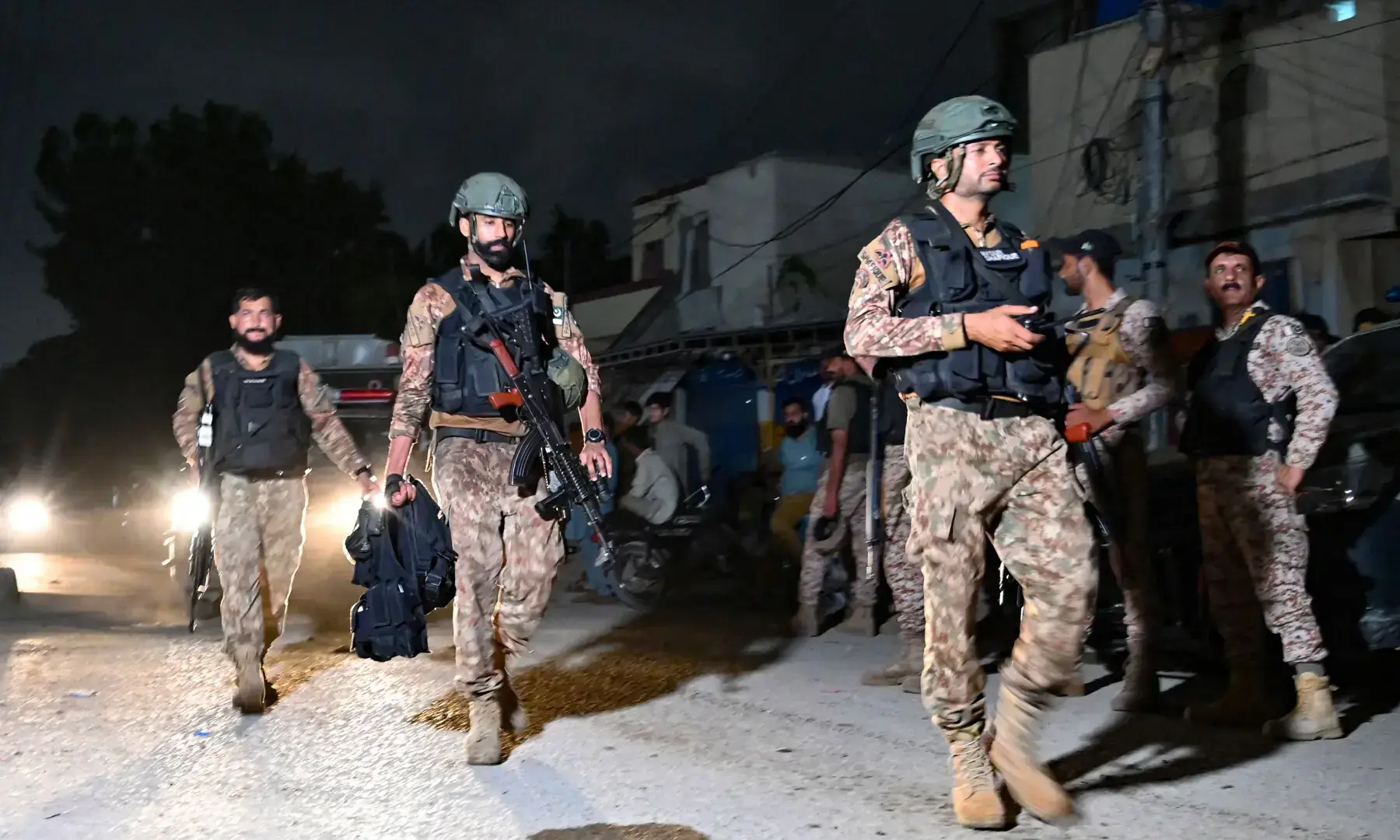 Security personnel leave the Mosamiyat Chowrangi area in Karachi on June 28, 2026, at the end of a clearance operation following a terrorist attack. — AFP/FIle Security personnel leave the Mosamiyat Chowrangi area in Karachi on June 28, 2026, at the end of a clearance operation following a terrorist attack. — AFP/FIle