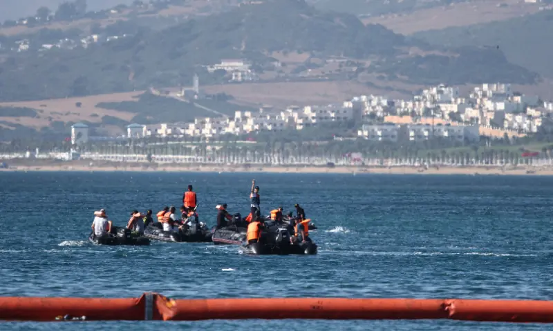 People aboard inflatable boats navigate on the Moroccan side of the new floating barrier deployed by Spain to reinforce security near the border post of the Spanish enclave of Ceuta on August 2, 2026. — AFP People aboard inflatable boats navigate on the Moroccan side of the new floating barrier deployed by Spain to reinforce security near the border post of the Spanish enclave of Ceuta on August 2, 2026. — AFP