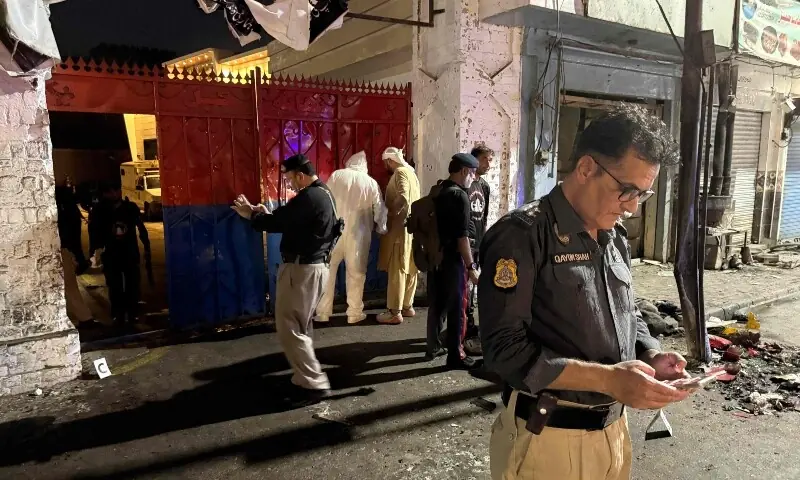 Police officials inspect the site following a suicide bombing during a protest in Swat district on August 2. — AFP Police officials inspect the site following a suicide bombing during a protest in Swat district on August 2. — AFP