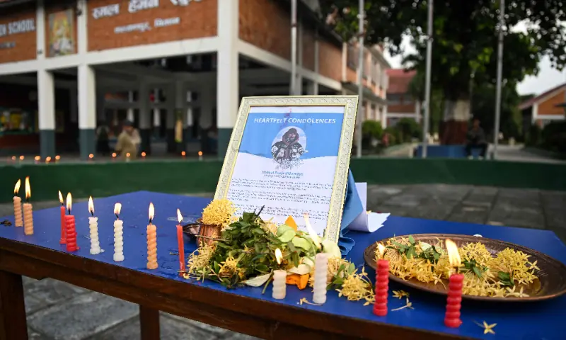 Mourners light candles to offer their condolences after the death of mountaineer Nirmal Purja and his companions in an avalanche in Pakistan, at Small Heaven School in Chitwan on August 2, 2026. — AFP Mourners light candles to offer their condolences after the death of mountaineer Nirmal Purja and his companions in an avalanche in Pakistan, at Small Heaven School in Chitwan on August 2, 2026. — AFP