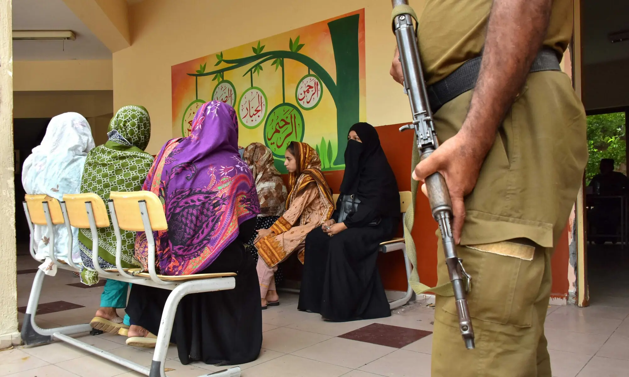 A policeman stands guard as women voters wait to cast their ballots at a polling station during the second phase of elections for the local legislative assembly in Muzaffarabad on August 2, 2026. — AFP A policeman stands guard as women voters wait to cast their ballots at a polling station during the second phase of elections for the local legislative assembly in Muzaffarabad on August 2, 2026. — AFP
