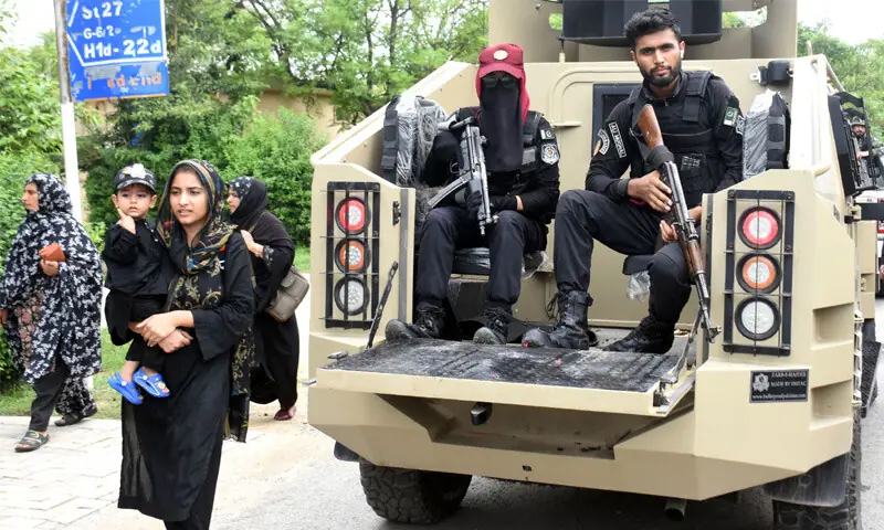 Armed security personnel patrol the route of Chehlum procession taken out from G-6/2 Imambargah in Islamabad on Monday. — Online Armed security personnel patrol the route of Chehlum procession taken out from G-6/2 Imambargah in Islamabad on Monday. — Online