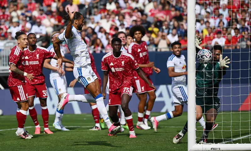 LEEDS United’s Dominic Calvert-Lewin (third L) scores past Liverpool goalkeeper Giorgi Mamardashvili during their pre-season friendly at the Soldier Field.—AFP LEEDS United’s Dominic Calvert-Lewin (third L) scores past Liverpool goalkeeper Giorgi Mamardashvili during their pre-season friendly at the Soldier Field.—AFP