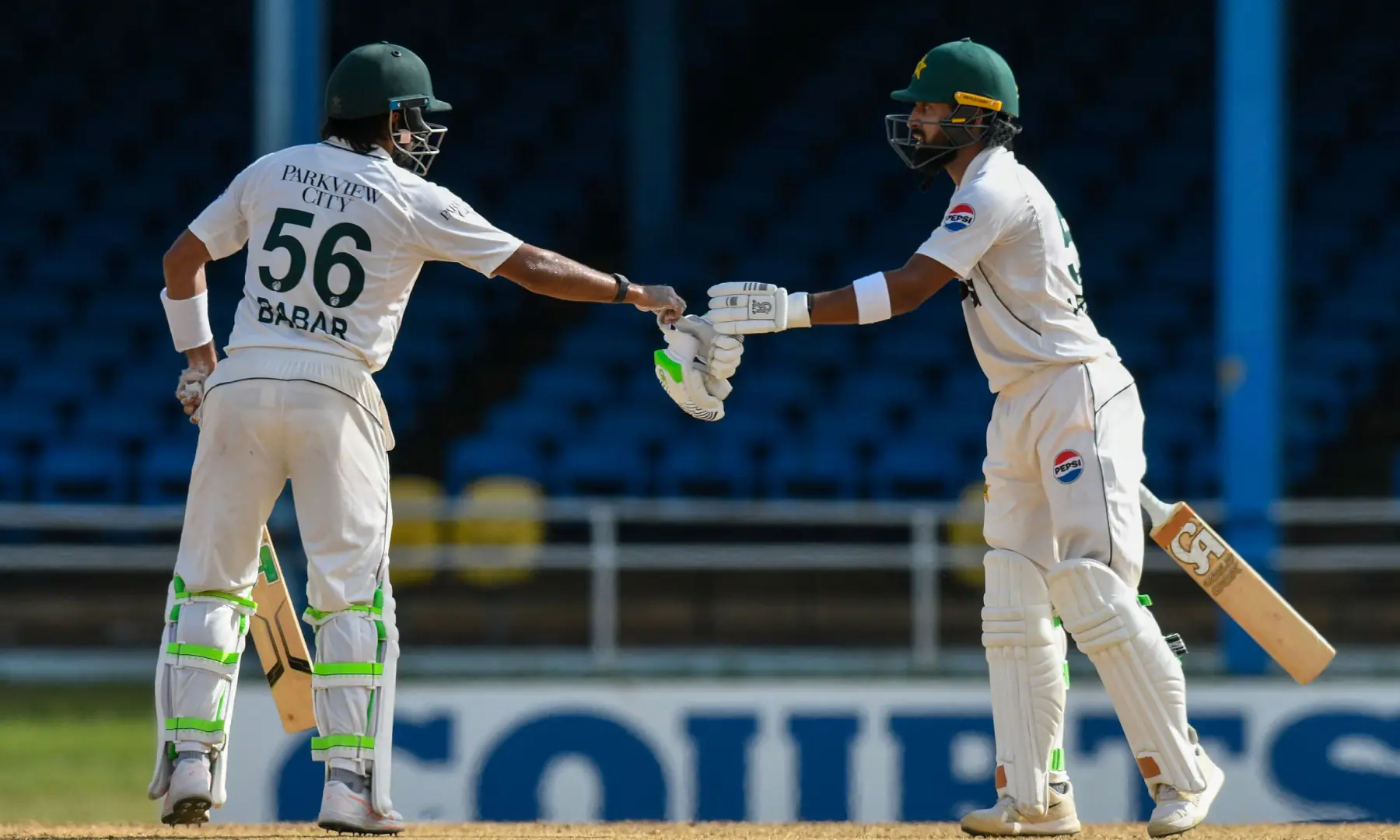 Pakistan's Babar Azam (L) and Abdullah Shafique (R) bump gloves during the second day of the second Test match between West Indies and Pakistan at Queen's Park Oval in Port of Spain, Trinidad and Tobago, on August 3, 2026. — AFP Pakistan's Babar Azam (L) and Abdullah Shafique (R) bump gloves during the second day of the second Test match between West Indies and Pakistan at Queen's Park Oval in Port of Spain, Trinidad and Tobago, on August 3, 2026. — AFP