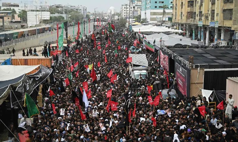 Shia Muslim devotees take part in the religious Chehlum procession in Karachi on August 4, 2026. — AFP Shia Muslim devotees take part in the religious Chehlum procession in Karachi on August 4, 2026. — AFP