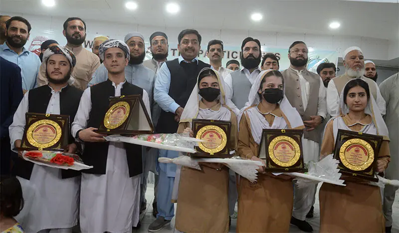 Elementary and secondary education secretary Mohammad Khalid in a group photo with the position holders in SSC exam result of BISE Peshawar on Tuesday. — White Star Elementary and secondary education secretary Mohammad Khalid in a group photo with the position holders in SSC exam result of BISE Peshawar on Tuesday. — White Star