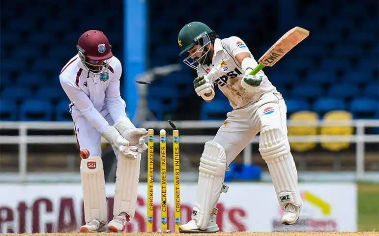 PAKISTAN batter Mohammad Rizwan is cleaned up by West Indies spinner Jomel Warrican during the second Test at the Queen’s Park Oval on Tuesday.—AFP PAKISTAN batter Mohammad Rizwan is cleaned up by West Indies spinner Jomel Warrican during the second Test at the Queen’s Park Oval on Tuesday.—AFP