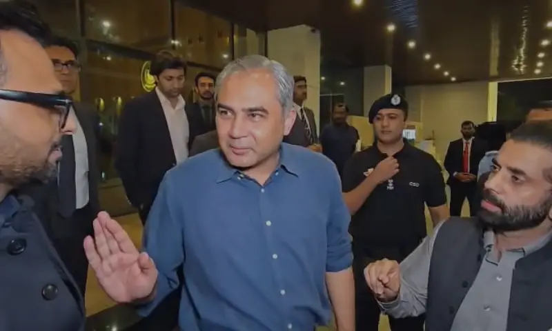 Interior Minister Mohsin Naqvi interacts with journalists outside the Interior Ministry office in Islamabad. &mdash; Screengrab