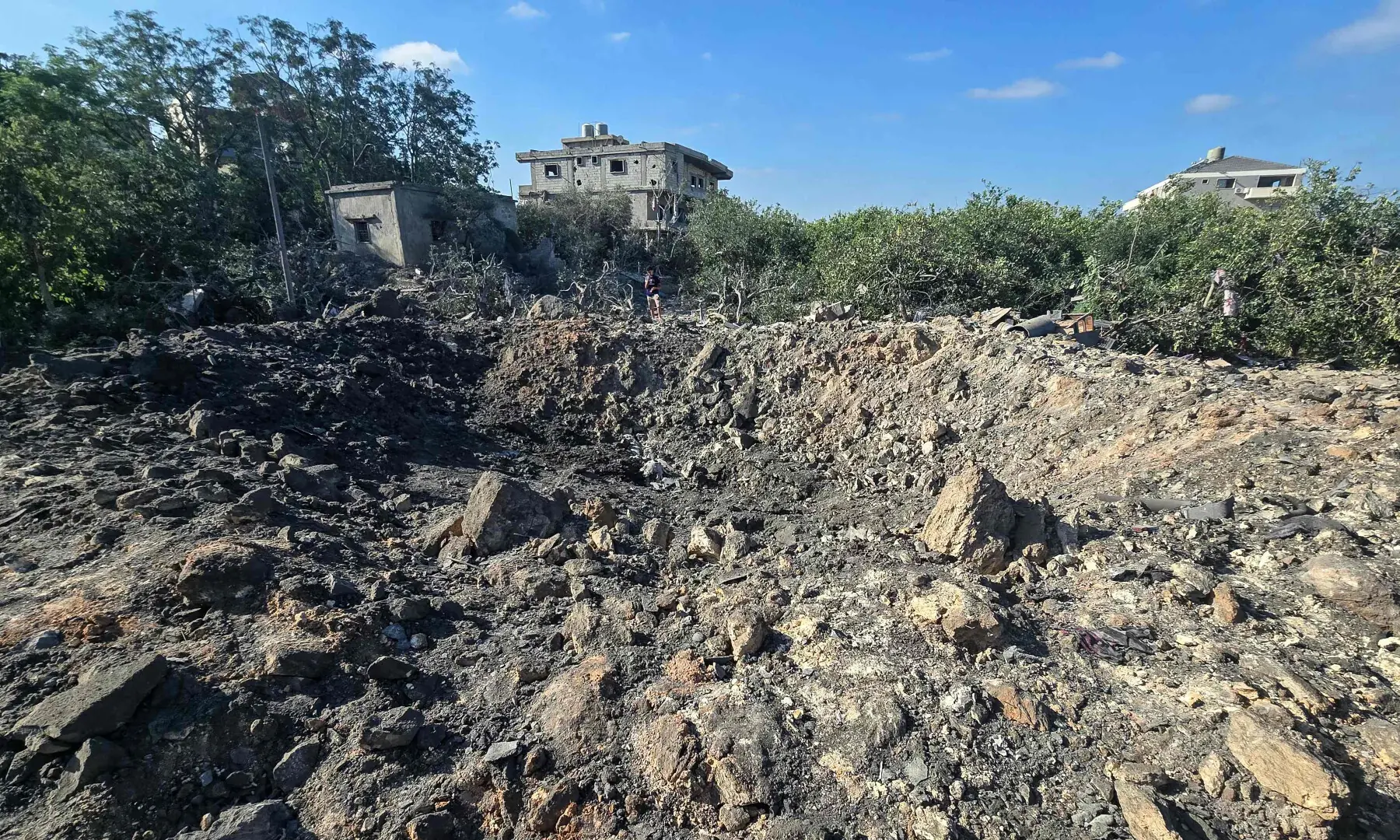 A photograph shows a crater left by an overnight Israeli airstrike that targeted a house in the area of Burj al-Shamali, near Tyre, on August 6, 2026. — AFP