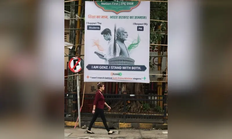 A woman walks past a hoarding depicting a student and Indian Prime Minister Narendra Modi on a street in Mumbai, India on August 5, 2026. —Reuters/File A woman walks past a hoarding depicting a student and Indian Prime Minister Narendra Modi on a street in Mumbai, India on August 5, 2026. —Reuters/File