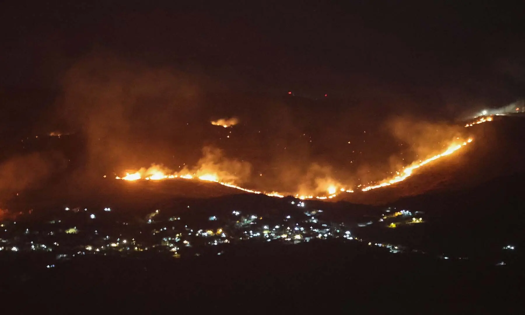 Forest fires sweep through the outskirts of the southern village of Kfar Shouba as a result of Israeli shelling that targeted the area, as seen from the southern Lebanese area of Marjayoun on August 5, 2026. &mdash; AFP