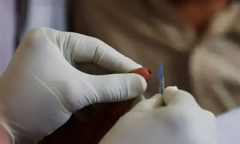 A medical worker draws blood for a HIV test at the free medical camp in Ratodero. — Reuters/File A medical worker draws blood for a HIV test at the free medical camp in Ratodero. — Reuters/File