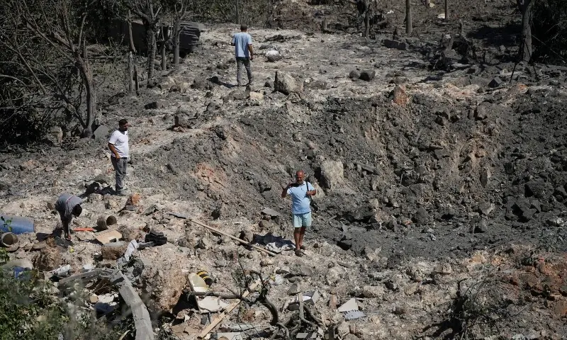 People and journalists stand at a site hit by Israeli strikes that occurred in the early hours of Thursday, according to Lebanon&rsquo;s state news agency NNA, in Burj al-Shamali, southern Lebanon, August 6, 2026. &mdash;Reuters