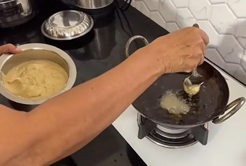 Deep frying jackfruit fritters in a wok