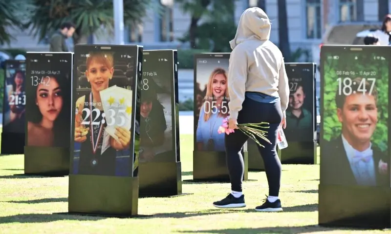 Images of deceased children are displayed at the 'Lost Screen Memorial', an art installation of large-scale smartphones featuring 50 children who lost their lives due to online harm, in Los Angeles, California on February 13, 2026. —AFP/File Images of deceased children are displayed at the 'Lost Screen Memorial', an art installation of large-scale smartphones featuring 50 children who lost their lives due to online harm, in Los Angeles, California on February 13, 2026. —AFP/File