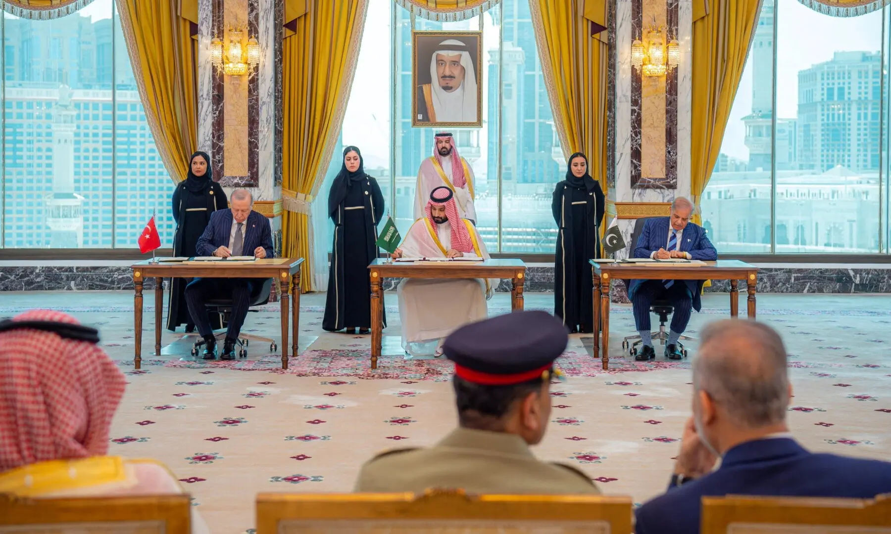 Turkish President Tayyip Erdogan, Saudi Crown Prince Mohammed bin Salman, and Prime Minister Shehbaz Sharif sign a joint defence agreement in Makkah, Saudi Arabia, on Aug 7, 2026. &mdash; Saudi Press Agency via Reuters