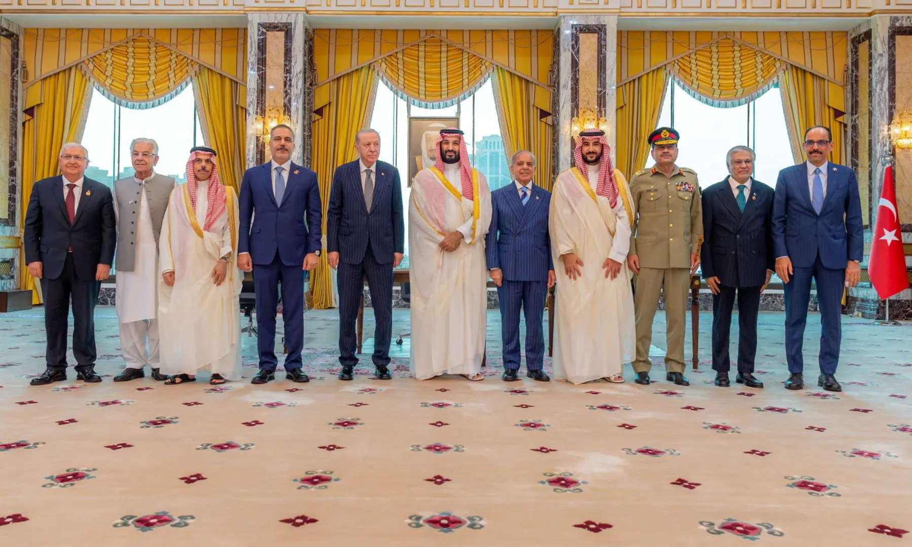 Turkish President Tayyip Erdogan, Saudi Crown Prince Mohammed bin Salman and Prime Minister Shehbaz Sharif, accompanied by their ministers of Foreign Affairs and Defence, pose after signing a joint defence agreement in Makkah, Saudi Arabia, on Aug 7, 2026. &mdash; Saudi Press Agency via Reuters