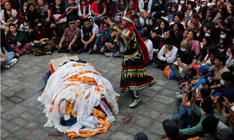 KATHMANDU: A shaman leads traditional funeral rituals during the cremation ceremony of Pur Bahadur Gurung.&mdash;Reuters