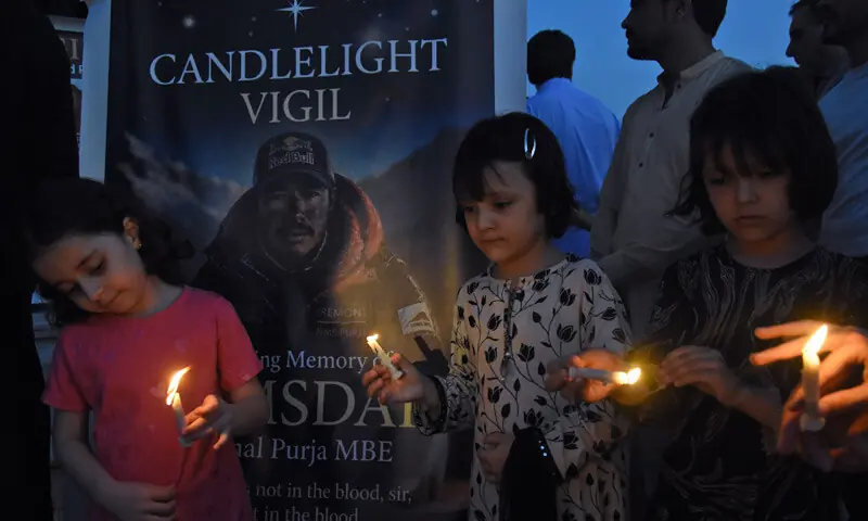Children sit solemnly during a candle light vigil held at Fatima Jinnah Park in Islamabad on Saturday in memory of mountaineers who lost their lives in an avalanche while attempting to summit 8,047-metre-high Broad Peak in Gilgit-Baltistan. — Dawn Children sit solemnly during a candle light vigil held at Fatima Jinnah Park in Islamabad on Saturday in memory of mountaineers who lost their lives in an avalanche while attempting to summit 8,047-metre-high Broad Peak in Gilgit-Baltistan. — Dawn
