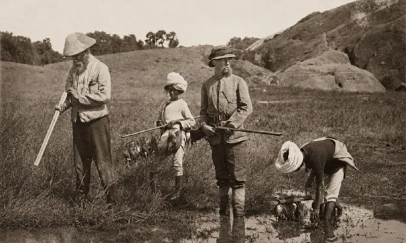 An 1870 photograph showing British colonial hunters accompanied by local staff during a hunt | Royal Geographical Society An 1870 photograph showing British colonial hunters accompanied by local staff during a hunt | Royal Geographical Society