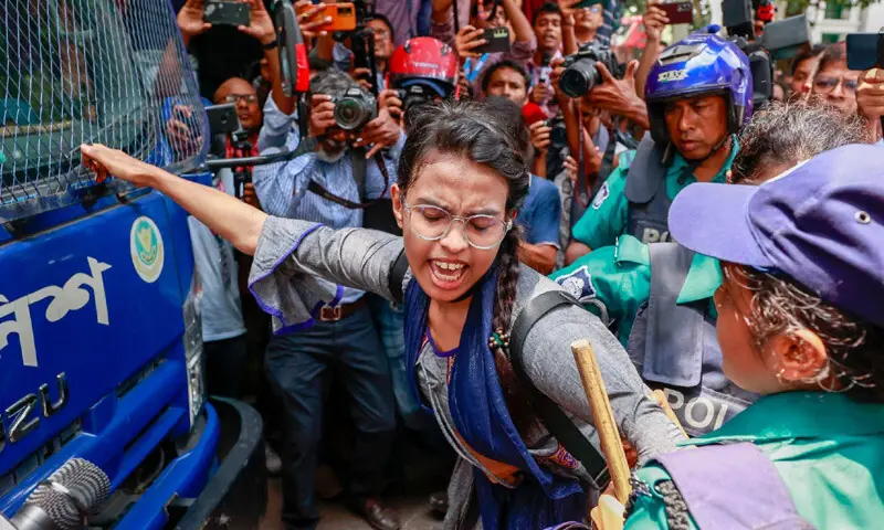 Nusrat Jahan stands in front of a police prison van during the July 2024 uprising, blocking its path | Courtesy Prothom Alo Nusrat Jahan stands in front of a police prison van during the July 2024 uprising, blocking its path | Courtesy Prothom Alo