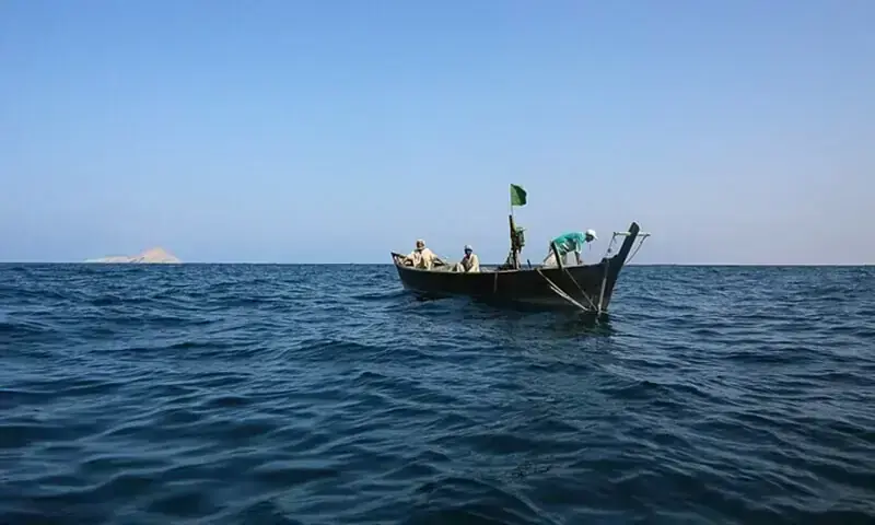 A fishing boat with fishermen floats on open waters under a clear blue sky. &mdash;Dawn/File Photo