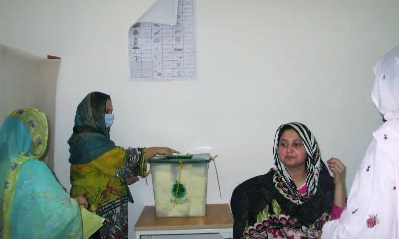In this 2021 file photo, a woman casts her ballot at a polling station in Muzaffarabad, Azad Jammu and Kashmir. — Reuters/File In this 2021 file photo, a woman casts her ballot at a polling station in Muzaffarabad, Azad Jammu and Kashmir. — Reuters/File