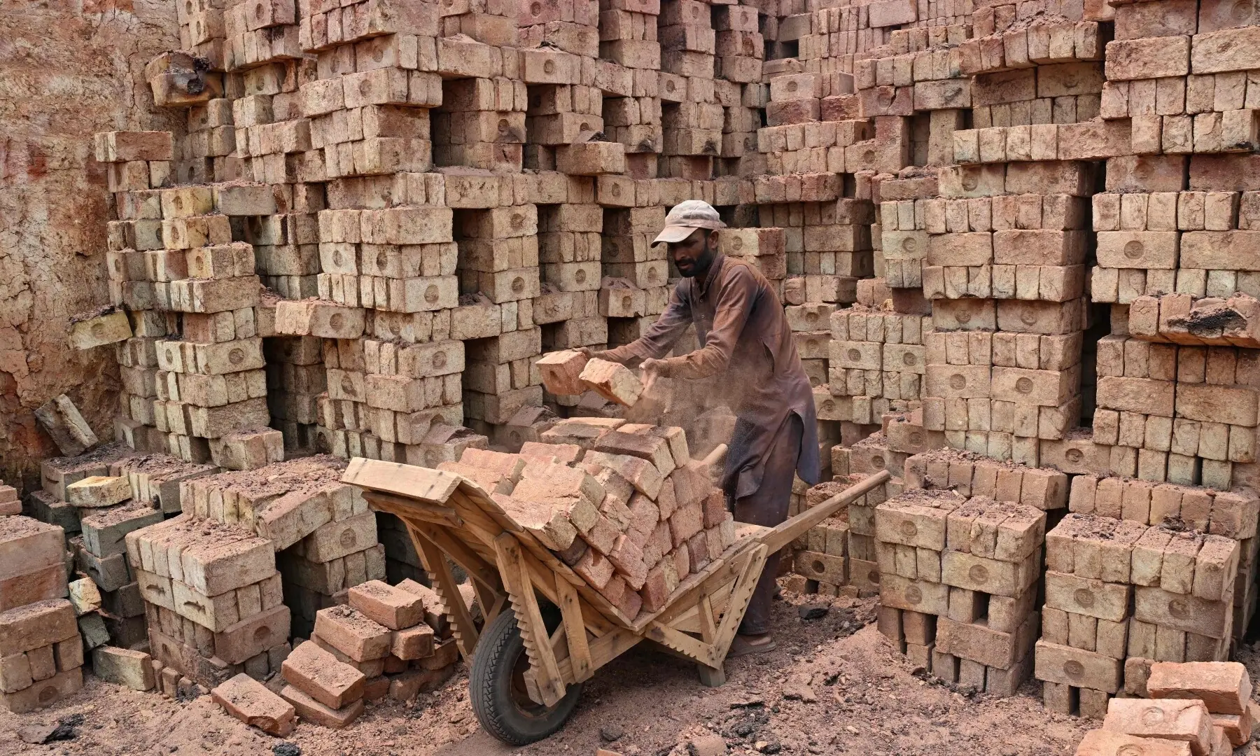 A man works at a brick kiln in Sheikhupura, Punjab on July 20, 2026. —AFP