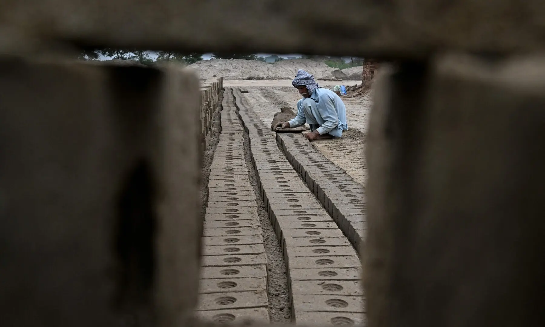 A man works at a brick kiln in Sheikhupura, Punjab on July 20, 2026. —AFP