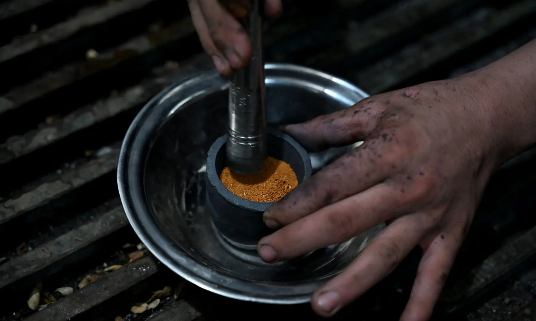 This photograph taken on August 4, 2026 shows an Afghan goldsmith melting gold at a workshop in Fayzabad, in Afghanistan&rsquo;s northeastern Badakhshan province. &mdash; AFP