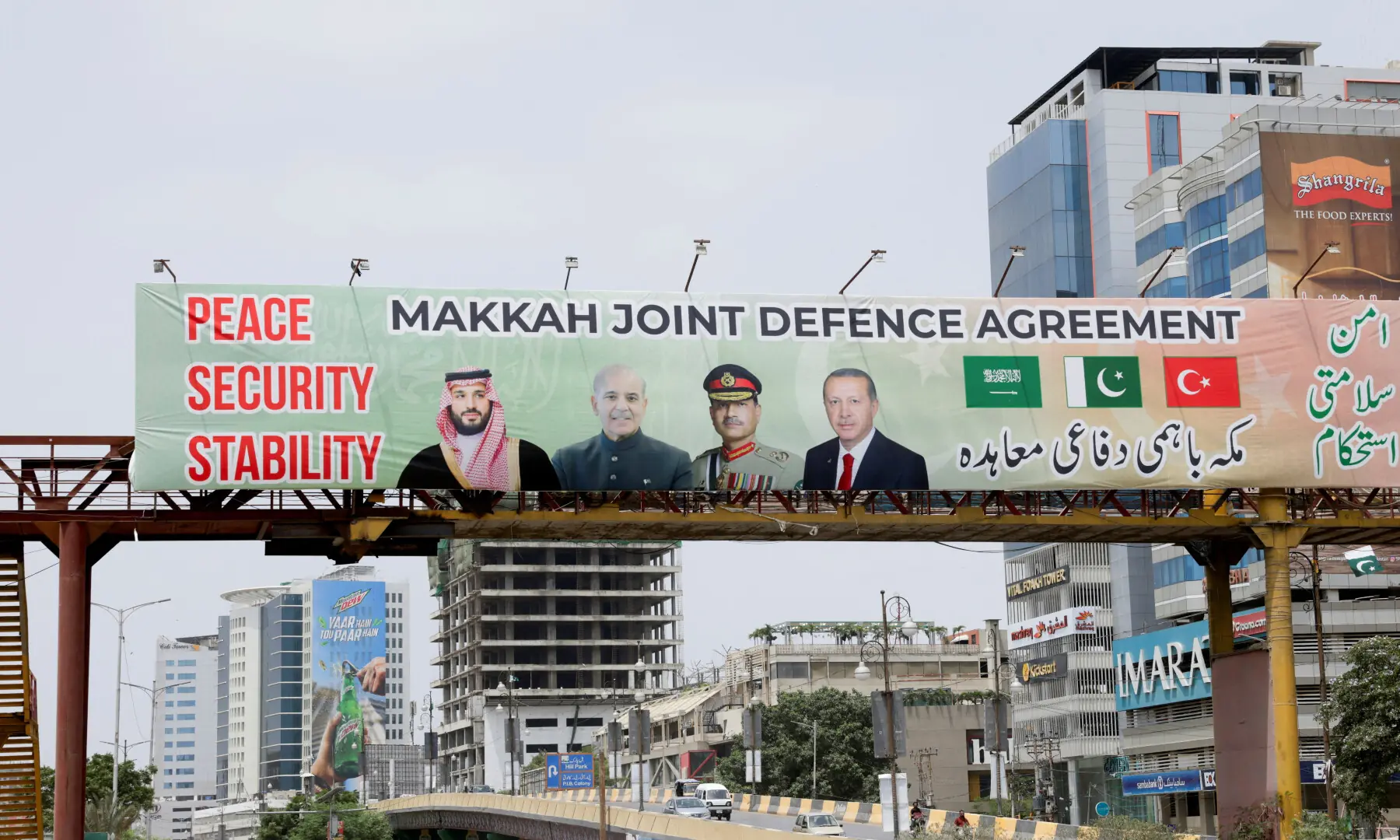 A billboard displays portraits of Saudi Crown Prince and Prime Minister Mohammed bin Salman, PM Shehbaz Sharif, Chief of Defence Forces (CDF) Field Marshal Asim Munir, and Turkish President Recep Tayyip Erdogan, following the signing of the Makkah Joint Defence Agreement, in Karachi on Aug 9, 2026. — AFP A billboard displays portraits of Saudi Crown Prince and Prime Minister Mohammed bin Salman, PM Shehbaz Sharif, Chief of Defence Forces (CDF) Field Marshal Asim Munir, and Turkish President Recep Tayyip Erdogan, following the signing of the Makkah Joint Defence Agreement, in Karachi on Aug 9, 2026. — AFP