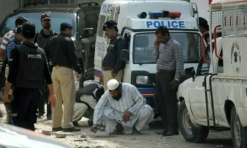 Police investigate a crime scene. — AFP/File Police investigate a crime scene. — AFP/File
