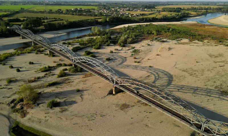 A drone view shows the Po River running low under Gerola Bridge as drought threatens rice fields, in Mezzana Bigli, Italy on August 6, 2026. — Reuters A drone view shows the Po River running low under Gerola Bridge as drought threatens rice fields, in Mezzana Bigli, Italy on August 6, 2026. — Reuters