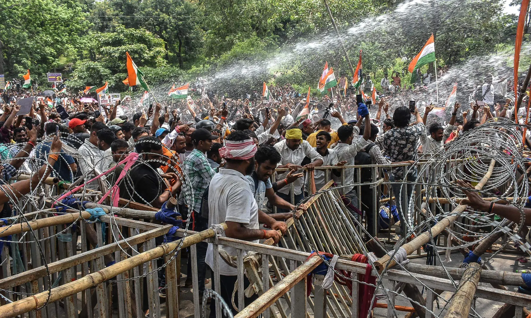 Police personnel use water cannon to disperse demonstrators during an ongoing protest against alleged irregularities in the Jharkhand Public Service Commission (JPSC) and Jharkhand Staff Selection Commission (JSSC) recruitment exams in Ranchi on Aug 10, 2026. &mdash; AFP