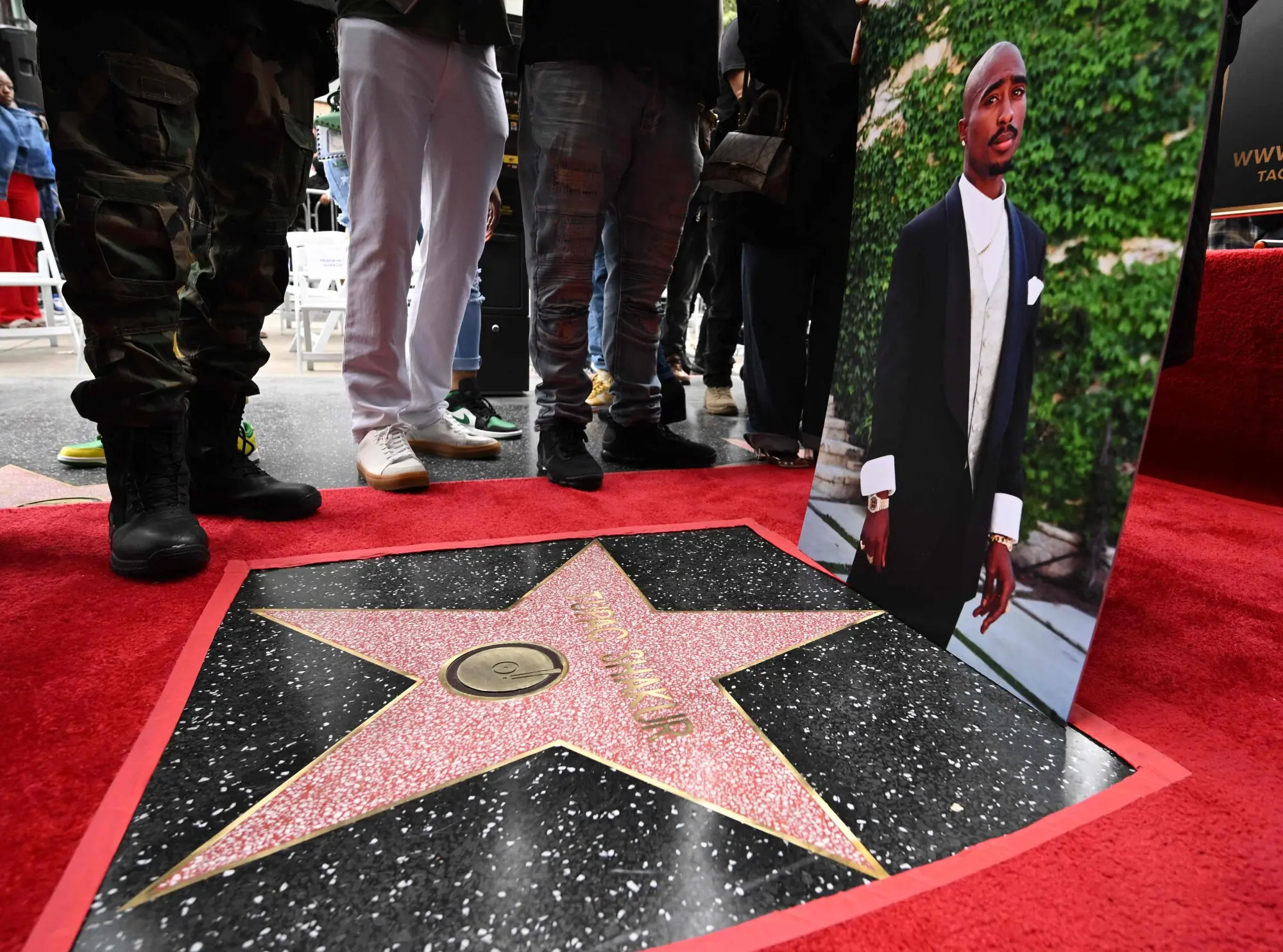 A portrait of rapper Tupac Shakur displayed at his star on the Hollywood Walk of Fame. Photo: AFP.
