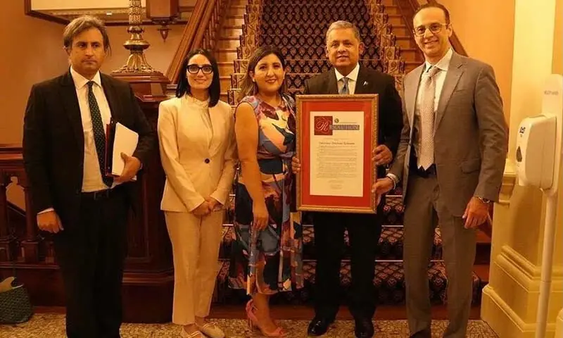 Pakistani Ambassador to the United States Rizwan Saeed Sheikh (2nd R) poses with California State Senator Melissa Hurtado (C) after a resolution was passed backing strong Pakistan-US ties, in this image released on August 12, 2026. &mdash; X/@PakinUSA