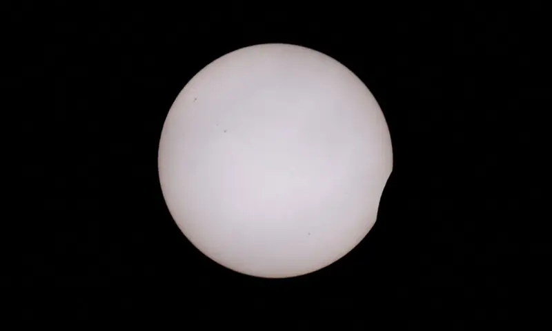 THE moon partially covers the sun during a solar eclipse, as seen from A Coruna, Spain.—Reuters THE moon partially covers the sun during a solar eclipse, as seen from A Coruna, Spain.—Reuters