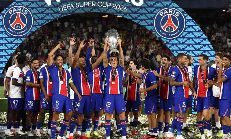 PARIS Saint-Germain players celebrate with the trophy after beating Aston Villa in the UEFA Super Cup match.&mdash;AFP