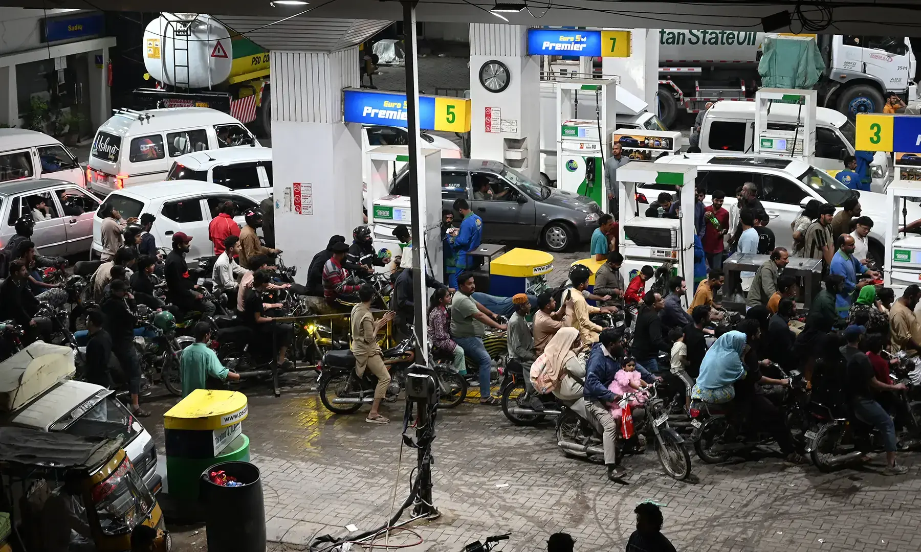People queue at a petrol station amid rising petrol prices in Karachi on April 3, 2026. —AFP/File People queue at a petrol station amid rising petrol prices in Karachi on April 3, 2026. —AFP/File