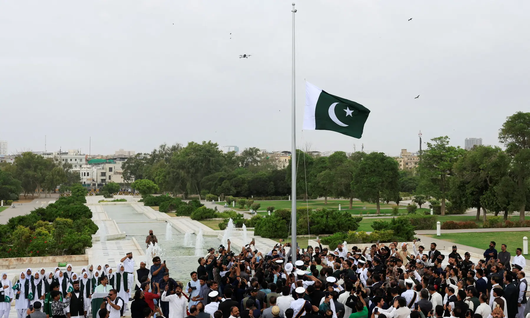 Attendees gather as Pakistan’s national flag is hoisted during Independence Day celebrations, at the mausoleum of Quaid-i-Azam Muhammad Ali Jinnah in Karachi on August 14, 2026. — Reuters