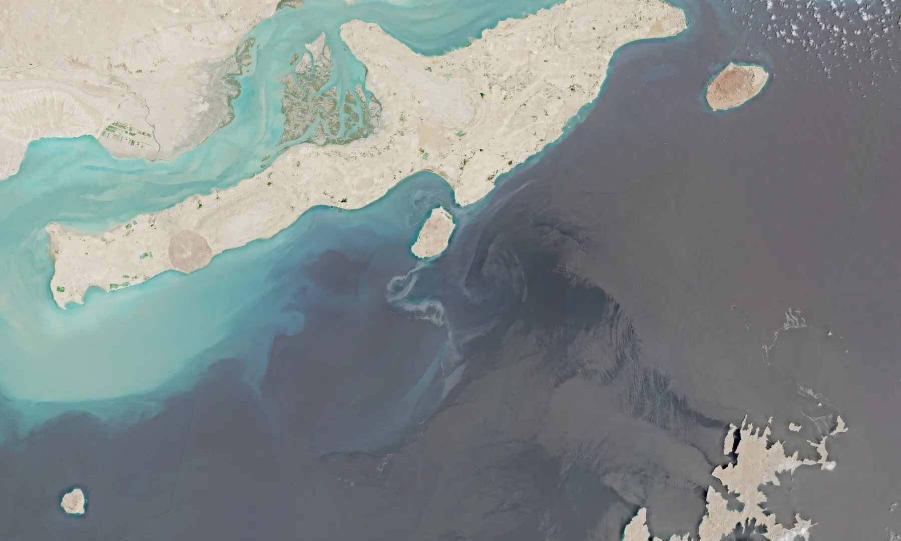 A satellite image shows Qeshm Island following suspected oil spills at sea, off the coast of Iran on August 10, 2026. &mdash; Reuters