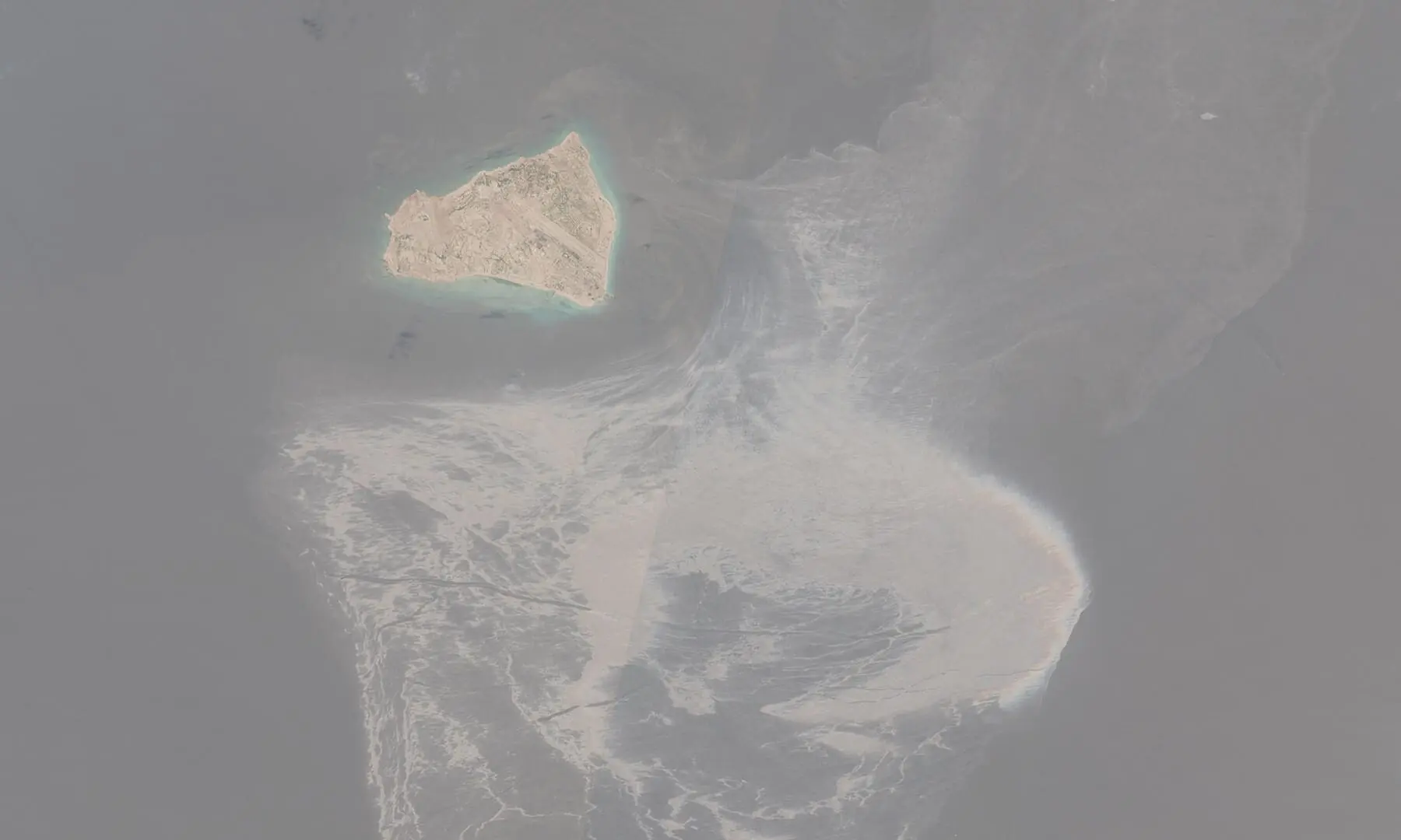A satellite image shows Siri island following suspected oil spills at sea, off the coast of Iran on August 13, 2026. &mdash; Reuters