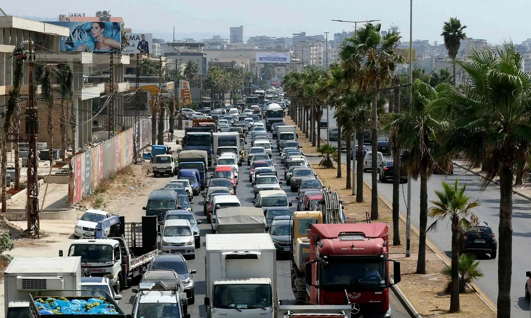 This picture taken in the southern Lebanese coastal city of Sidon shows lines of cars as people flee their villages in the south on August 15, 2026. &mdash; AFP
