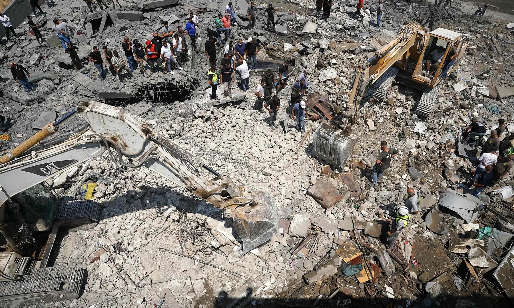 A man looks on as first aid responders and residents search to the site of an Israeli airstrike that targeted a neighborhood in the southern Lebanese village of Deir al-Zahrani on August 15 2026. &mdash; AFP