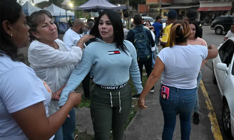 Former Venezuelan political prisoner Lorena Garcia (centre) reunites with relatives outside a prison following her release from the La Crisalida women’s detention centre in Los Teques.—AFP Former Venezuelan political prisoner Lorena Garcia (centre) reunites with relatives outside a prison following her release from the La Crisalida women’s detention centre in Los Teques.—AFP