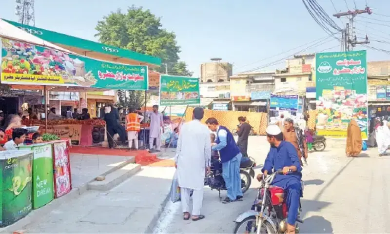 People purchase commodities from a Sahulat Bazaar. — Dawn/File People purchase commodities from a Sahulat Bazaar. — Dawn/File