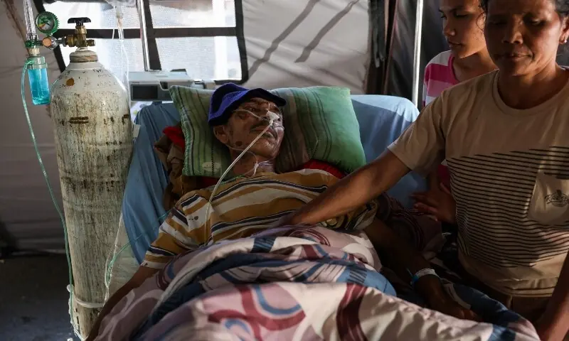 Benedictus Sokar, 50, an earthquake survivor, lies on a hospital bed while receiving treatment in a makeshift tent outside the Ben Mboi Manggarai regional hospital in the aftermath of an earthquake, in Ruteng, Manggarai regency, East Nusa Tenggara province, Indonesia, August 17, 2026. &mdash; Reuters