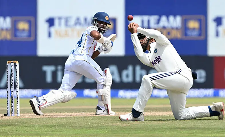 SRI LANKAN batter Sonal Dinusha watches the ball after playing a shot during the first Test against India at the Galle International Stadium on Monday.—AFP SRI LANKAN batter Sonal Dinusha watches the ball after playing a shot during the first Test against India at the Galle International Stadium on Monday.—AFP