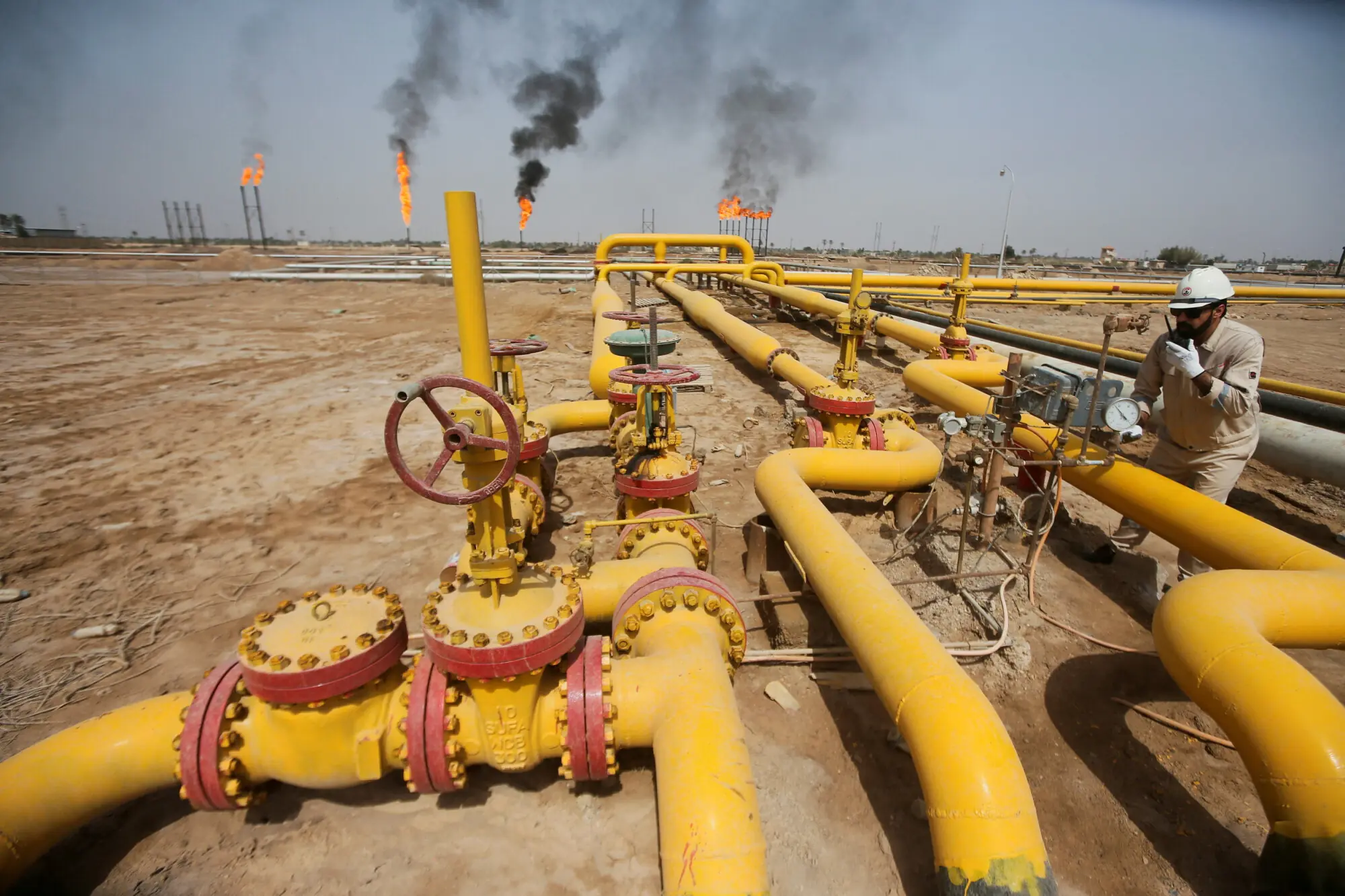 A worker checks an oil pipeline at Nahr Bin Umar oil field, north of Basra, Iraq March 22, 2022. — Reuters/File A worker checks an oil pipeline at Nahr Bin Umar oil field, north of Basra, Iraq March 22, 2022. — Reuters/File