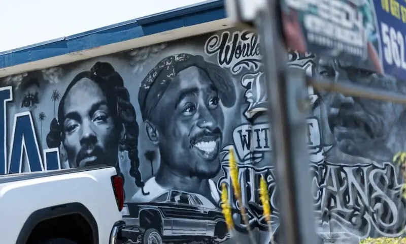 A mural depicting late rapper Tupac Shakur on the side of a building in Bellflower California, during the opening day of the trial for Duane Davis, who is charged for his alleged role in leading a group of men to kill Shakur in a 1996 drive-by shooting near the Las Vegas Strip, U.S., August 10, 2026. &mdash; Reuters